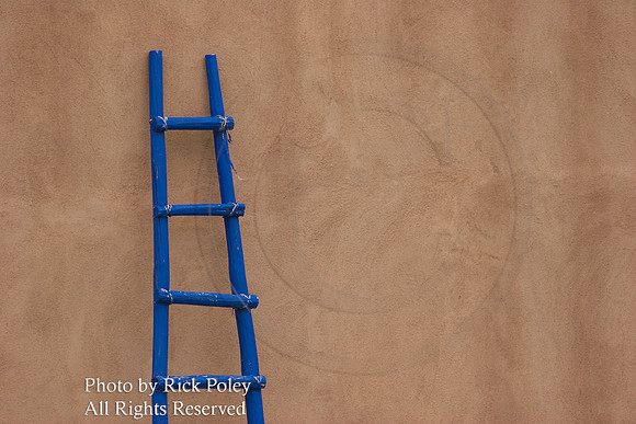 Blue Kiva Ladder on Adobe Wall