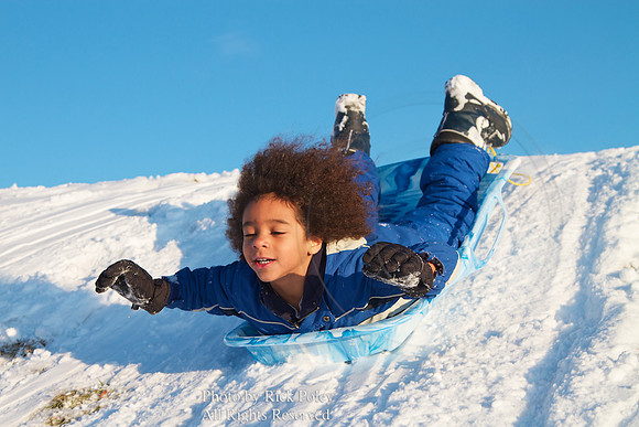 Young Boy Sledding