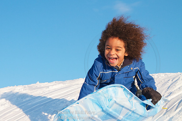 Young Boy Sledding
